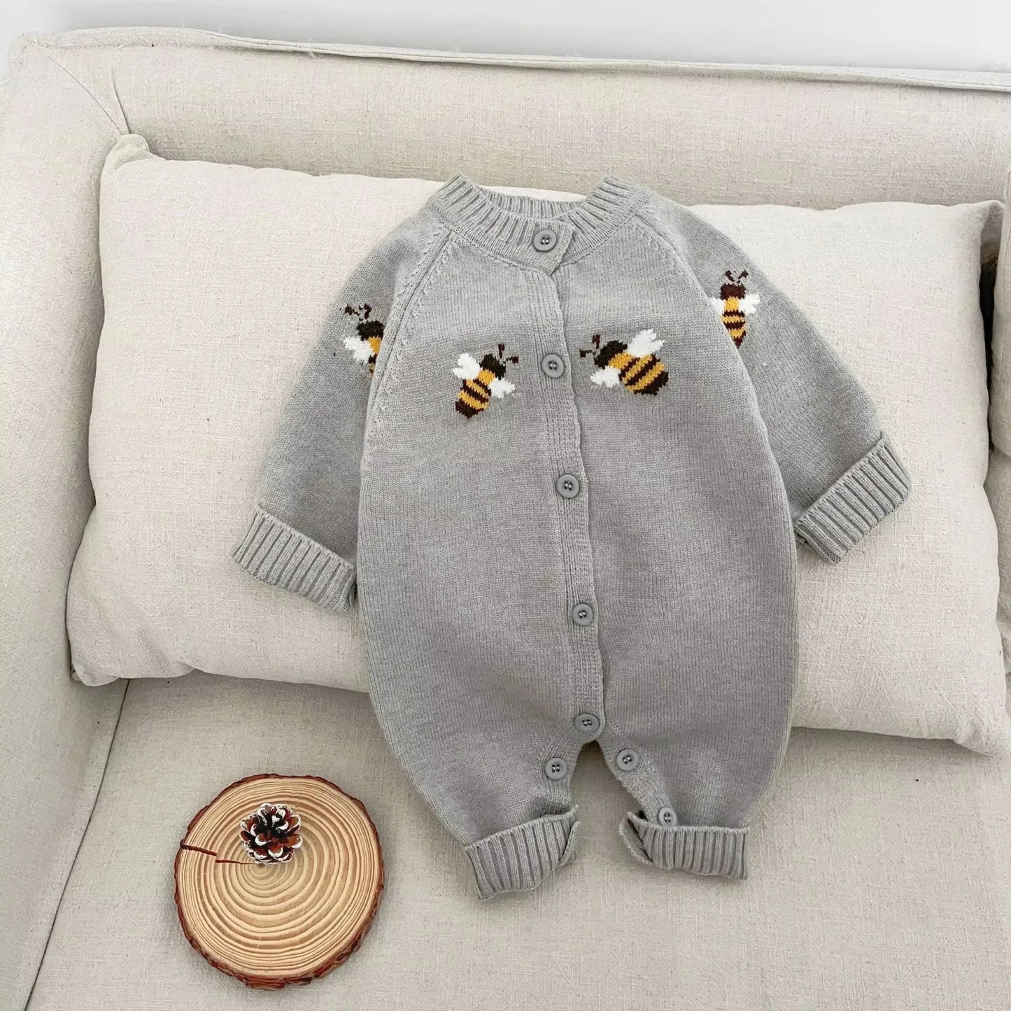 Gray baby romper with bee design