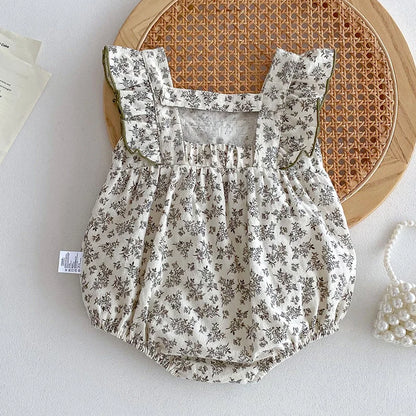 Gardenia Floral Baby Onesie with Bow - Peachy Bloomers